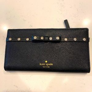 Black Kate Spade wallet with rhinestone detail